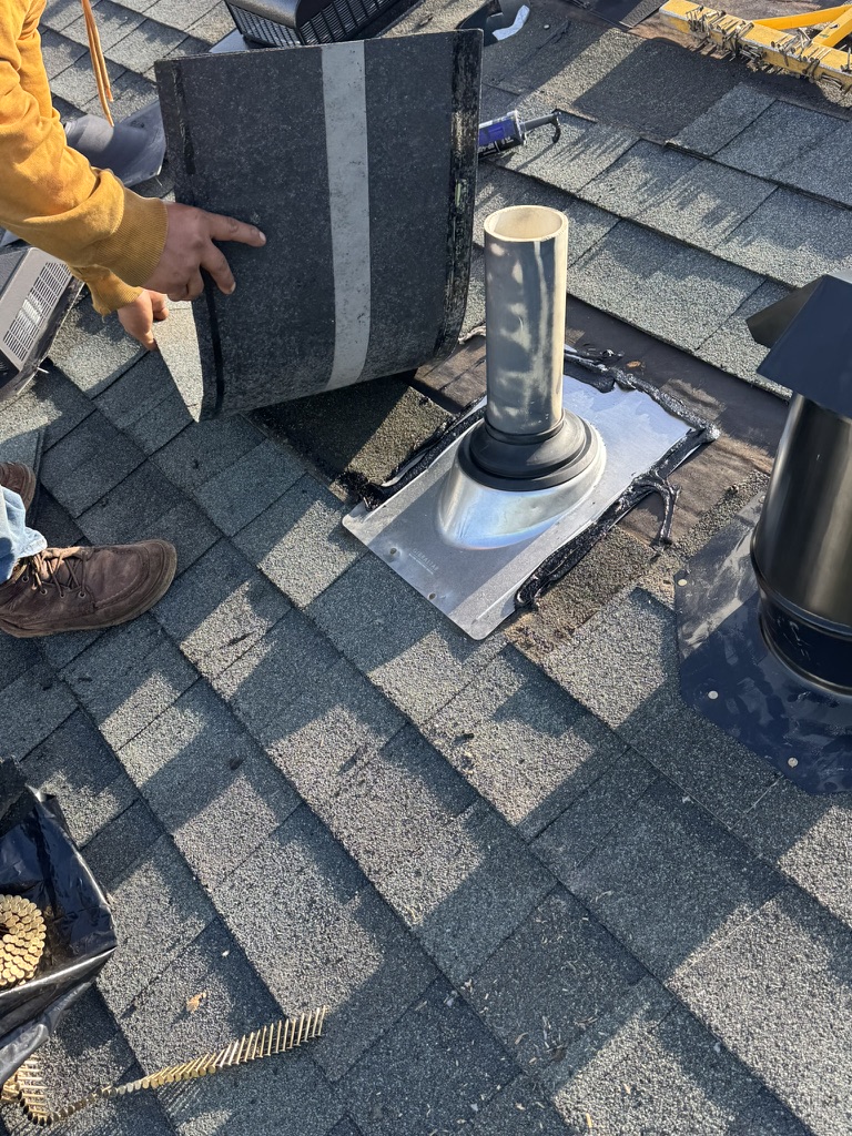 Roof replacement in progress on a residential home